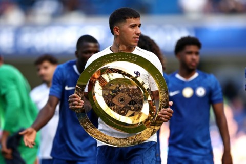Chelsea's Enzo Fernandez carries the Club World Cup trophy