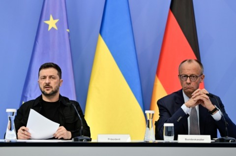 Ukrainian President Volodymyr Zelensky and German Chancellor Friedrich Merz attend an online talk of European leaders with US President Donald Trump on the Ukraine war