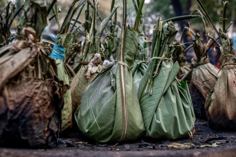 The fish or meat is wrapped up with spices, tomatoes, peppers, onions, garlic and chillies before grilling