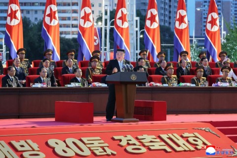 A picture taken on August 14 and released from North Korea's official Korean Central News Agency via KNS on August 15 shows Kim Jong Un delivering a speech marking the 80th anniversary of the liberation of Korea from Japan colonial rule