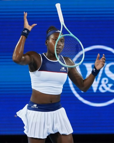 Frustrated Coco Gauff tosses her racquet during her quarter-final loss to Jasmine Paolini at the ATP-WTA Cincinnati Open
