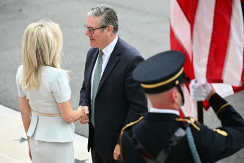 British Prime Minister Keir Starmer is greeted by US Chief of Protocol Monica Crowley (L) upon arrival at the White House South Portico in Washington, DC, on August 18, 2025