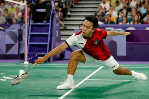 Indonesia's Anthony Ginting in action against France's Toma Junior Popov at the Paris 2024 Olympic Games