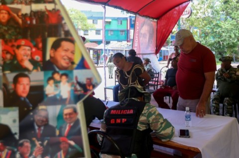 Militia registration centers were set up across the capital Caracas