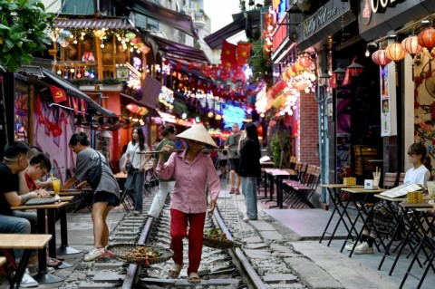 Previously in a notoriously rough part of town frequented by drug users and squatters, Hanoi's stretch of track now offers a business opportunity for enterprising baristas