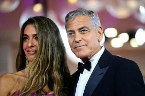 Clooney and his wife Amal on the Venice red carpet on Thursday
