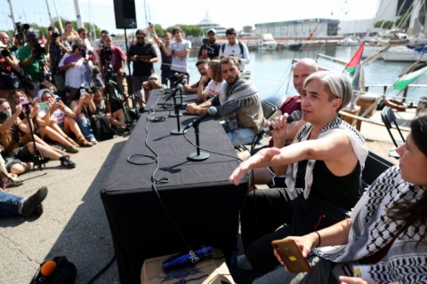 Former Barcelona mayor Ada Colau delivers a speech at the flotilla launch