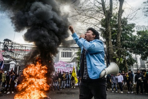 A demonstrator shouts slogans during a protest demanding police reform and the dissolution of the parliament in Bandung