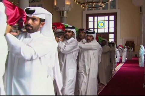 Pallbearers carry the shrouded bodies of the dead inside Doha's Sheikh Mohammed bin Abdul Wahhab Mosque in this Qatar TV image.