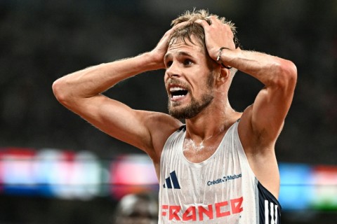 France's Jimmy Gressier reacts after winning the world 10,000m