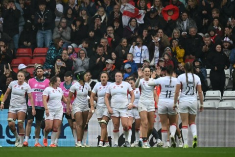 England players celebrate their 40-8 Women's Rugby World Cup quarter-final win over Scotland in Bristol