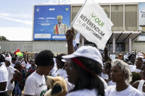 A billboard of Guinea President Mamady Doumbouya is seen during a "yes" vote rally at the People's Palace in Conakry on September 18, 2025