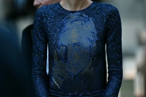 The final dress in the show, a sweeping blue glittering gown, featured the Armani's face, drawing applause