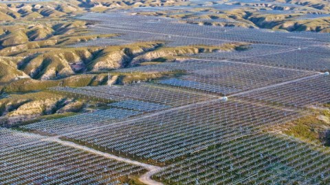 Solar panels are seen on hilltops at the Yinchuan Fourth Photovoltaic Power Station in Yinchuan, in China’s northern Ningxia region