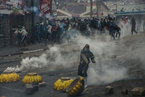 A protester threw a stone at security forces