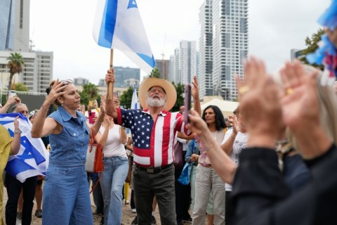 People waved Israeli and US flags in Tel Aviv's Hostages Square