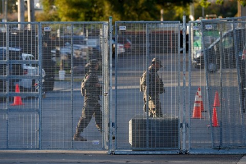 National Guard troops are seen near an entrance to a US Immigration and Customs Enforcement (ICE) detention facility in Broadview, Illinois
