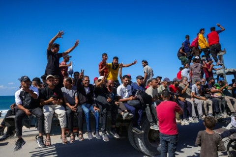 Palestinians make their way toward Gaza City from Nuseirat in the central Gaza Strip