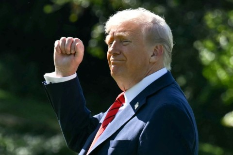 US President Donald Trump gestures as he walks to Marine One on the South Lawn of the White House in Washington, DC, on October 10, 2025, on his way to Walter Reed National Military Medical Center to receive a medical checkup.
