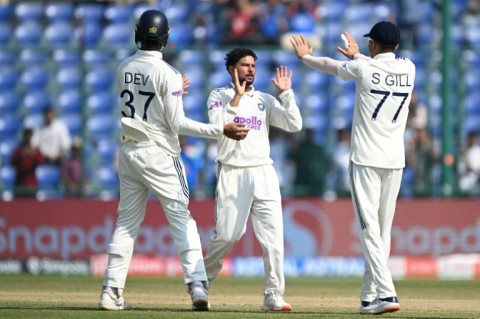 India's Kuldeep Yadav (centre) celebrates after taking the wicket of the West Indies' Justin Greaves