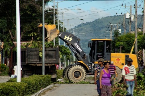 Crews clear away pruned tree branches ahead of the arrival of Melissa in Santiago de Cuba on October 25, 2025