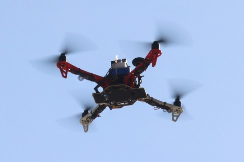 A drone built by engineering students executes a test flight at Iran's Tech Olympics