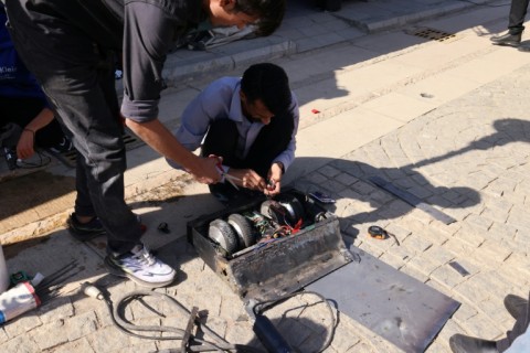 Engineering students prepare their robot for a battle event at Iran's Tech Olympics