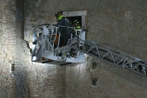 Rescuers worked to evacuate a worker who was trapped in the medieval tower Torre dei Conti after the tower partially collapsed in the historic center of Rome