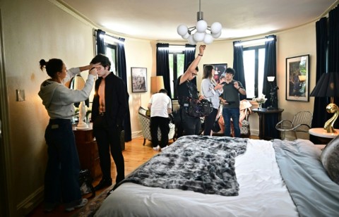 Ukraine-born actor Zachary Shadrin, second from left, gets a final makeup check before a bedroom scene in the vertical drama 'Love Through All Seasons'