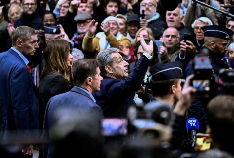 A large crowd of supporters saw Sarkozy off to jail