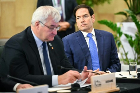 US Secretary of State Marco Rubio sits next to Ukraine's Foreign Minister Andriy Sybiha during a G7 meeting
