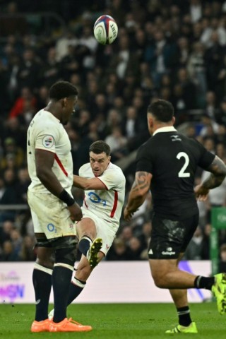 England fly-half George Ford kicks a drop-goal against New Zealand at Twickenham