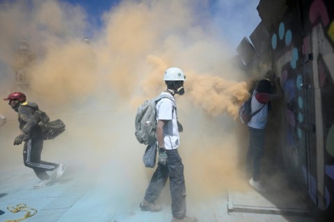 Police protecting the compound used tear gas grenades and fire extinguishers to contain the protesters