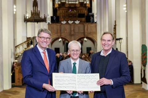 Bach researcher Peter Wollny (centre) is joined by German Culture Minister Wolfram Weimer (left) and mayor of Leipzig Burkhard Jung (right)