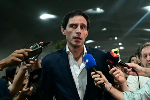 The European Union's climate commissioner, Wopke Hoekstra (C), says the deal on the table at UN climate talks is 'unacceptable'