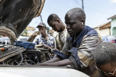 Conakry mechanic Mamadou Diallo Yero, pictured, told AFP 'we manage, we earn a little for food, nothing more'