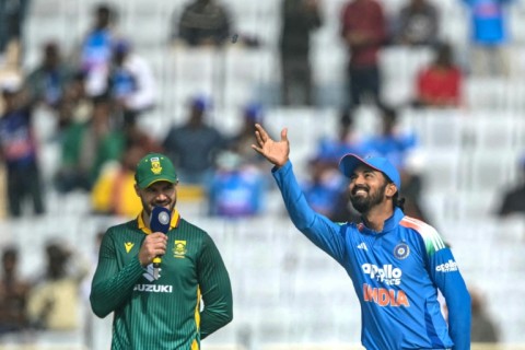 India's captain KL Rahul (R) tosses the coin as his South African counterpart Aiden Markram looks on