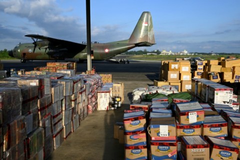 Supplies to be delivered to areas affected by flooding are seen at an Indonesian Air Force base in Sultan Iskandar Muda