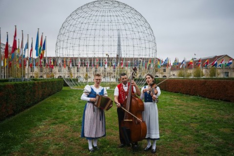Katja Burgler (L), Maya Stieger (R) and Peter Looser perform in the garden of the UNESCO headquarters in Paris