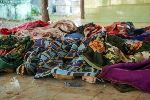 Bodies of victims are seen covered after a Myanmar military air strike that killed more than 30 people at a hospital in Mrauk U, western Rakhine state