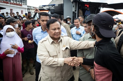 Indonesian President Prabowo Subianto met residents displaced by floods, acknowledging the condititions were 'difficult'