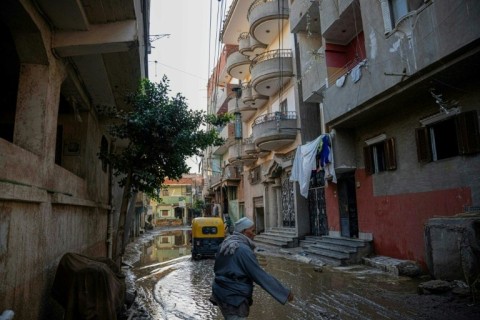 Rain floods the Nagrig street where Mohamed Salah grew up