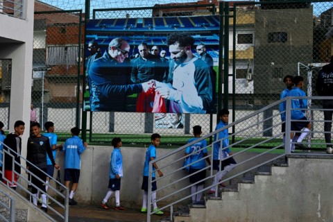 Young footballers head for the pitch at the Mohamed Salah sports complex in Nagrig