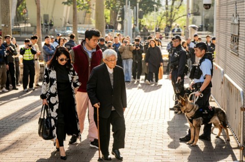 Jimmy Lai's wife Teresa (L), son Lai Shun-yan (C) and pro-democracy veteran Cardinal Joseph Zen (R)arrive at court for Lai's verdicts