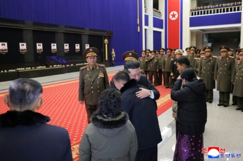 A picture released by North Korea's official Korean Central News Agency (KCNA) showing North Korean leader Kim Jong Un meeting with relatives of fallen North Korean soldiers, killed during their overseas deployment in Russia's Kursk region