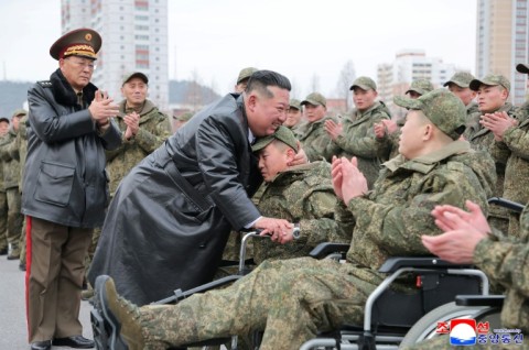 A picture released from North Korea's official Korean Central News Agency (KCNA) showing North Korean leader Kim Jong Un welcoming soldiers