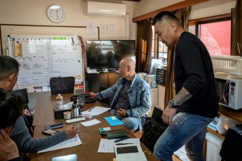 Former yakuza gangster Yoshiro Nishino (R) at his home for ex-offenders in Chiba Prefecture