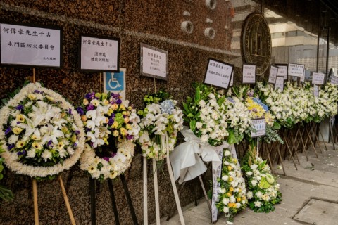 Floral tributes placed in mourning at the funeral for firefighter Ho Wai-ho, who died in the deadly fire at the Wang Fuk Court