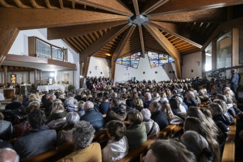 Attendees look on during a memorial mass at Crans-Montana's the catholic chapel of Saint-Christophe