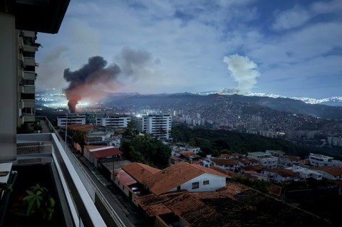 Smoke billows over Caracas after a series of explosions that were part of a US military operation
